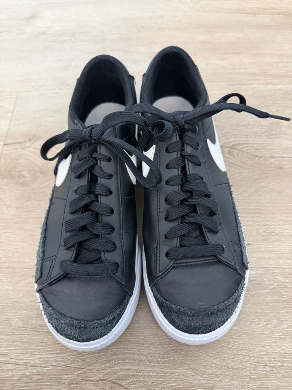 Nike Men’s Black Sneakers with White Swoosh